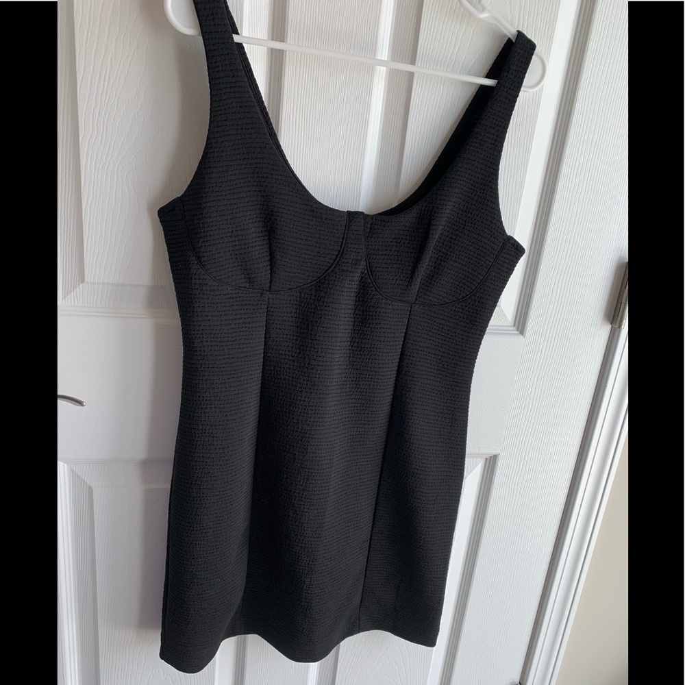 Black stretchy cocktail dress.